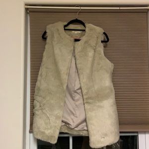 White fur vest